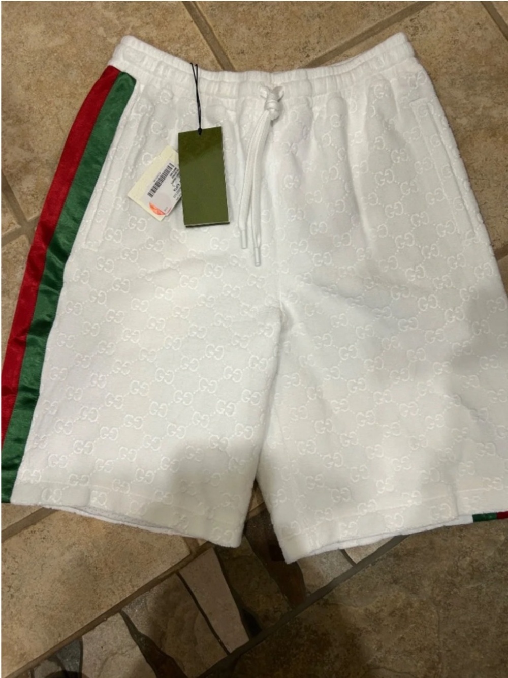 Men’s Gucci white GG embossed Terry cloth shorts. Size.S. Adjustable waist.